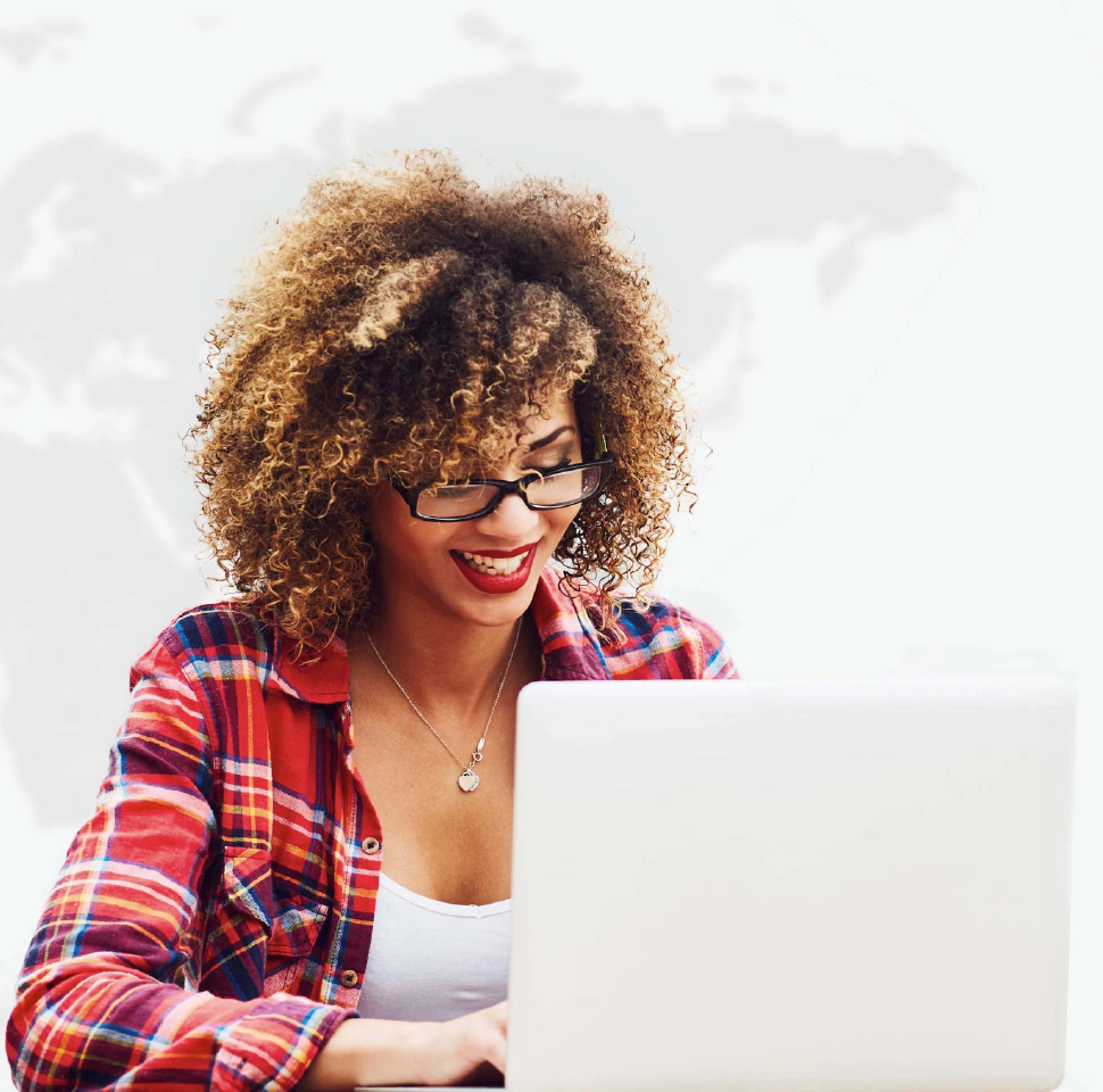 woman working on laptop with a world map background